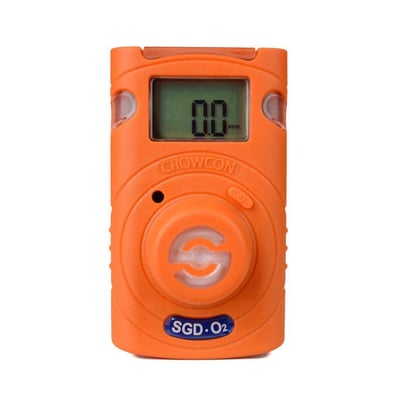Front view af Crowcon Clip SGD O2 gasdetektor i orange. Displayet viser 0.0 PPM og et symbol for ilt, står isoleret på hvid baggrund.