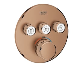 Grohtherm SmartControl termostat i børstet kobber med tre runde trykknapper til forskellige funktioner og et stort drejehjul til temperaturkontrol.
