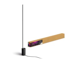 Philips Hue Signe gradient gulvlampe i sort aluminium står ved siden af sin papkasse med produktinformation.