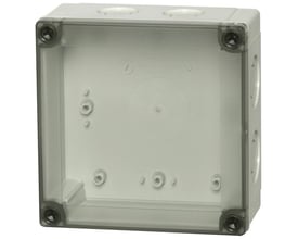 Detalje af Fibox MNX kasse med indvendige monteringspunkter og cirkulær prægning på bagvæggen.