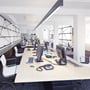 Svart V-TAC LED-takarmatur henger over arbeidsbord i et lyst, moderne kontor.