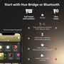 Sammenligning af muligheder for Philips Hue start med Bluetooth eller Hue Bridge, viser funktioner for 'Full home and outdoor' og 'One room'.